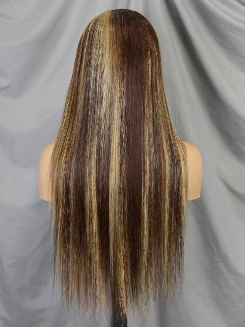 Long, straight wig with dark brown and golden blonde highlights, shown from the back on a mannequin head against a gray fabric backdrop.