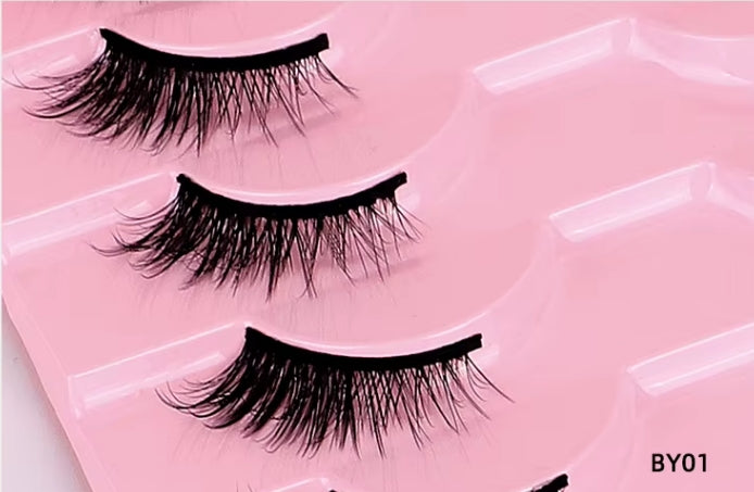 Three pairs of black false eyelashes arranged in a pink plastic tray, with the text 'BY01' in the bottom right corner.