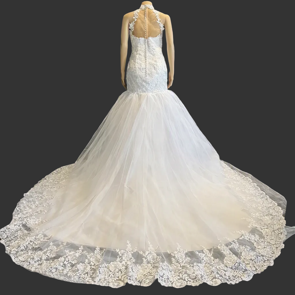 White halter neck lace mermaid bridal gown with cathedral train, front view in restaurant doorway
