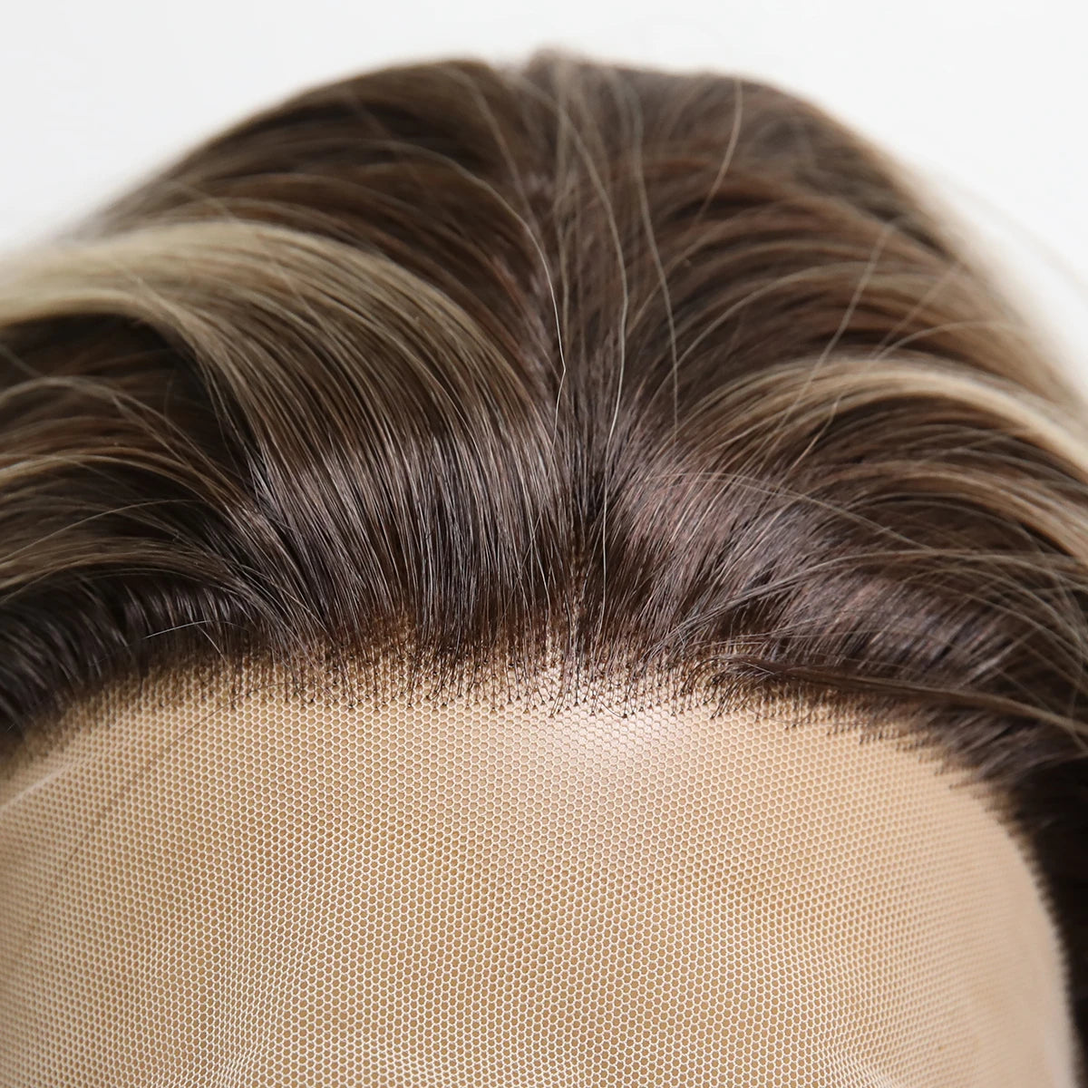 Close-up of 13x4 transparent lace front hairline on brown blonde gradient wig