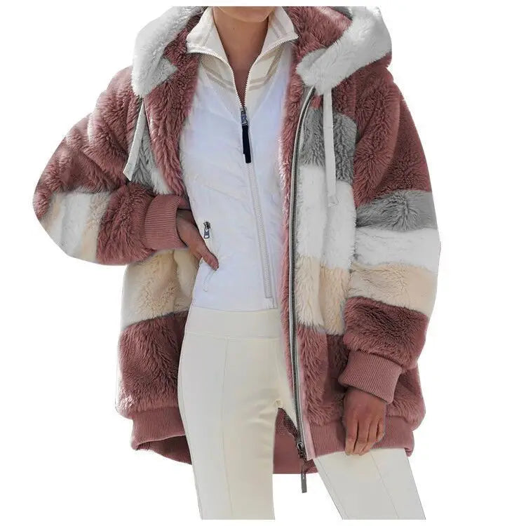 Person wearing a fluffy, multicolored jacket on a white background