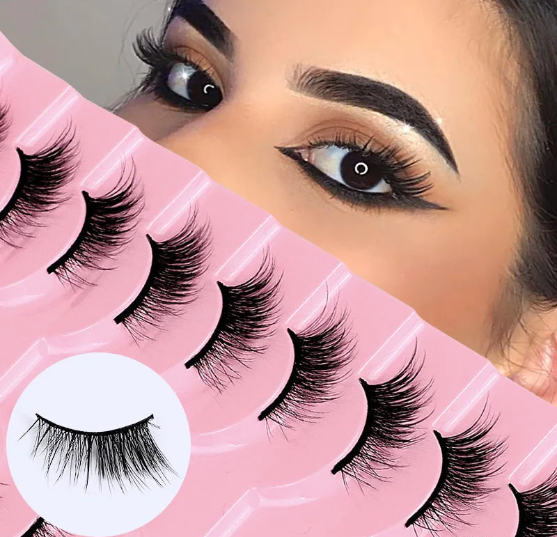 False eyelashes in packaging with a close-up of an eye wearing them.
