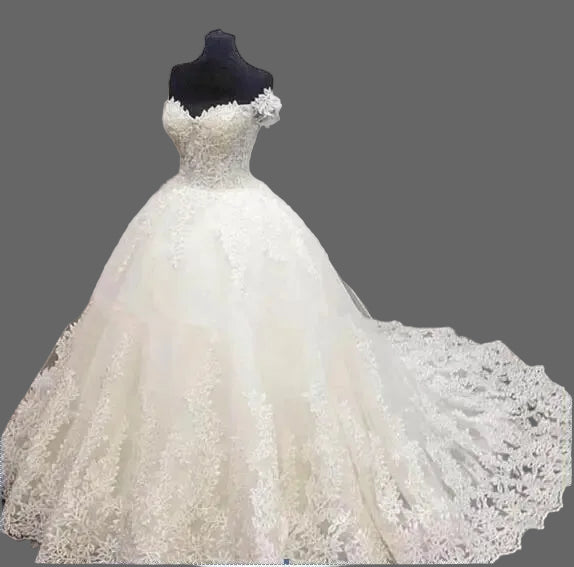 lace ball gown with off-shoulder sleeves and court train on dress form