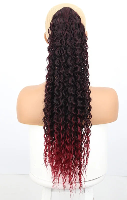 Image 3 — Water wave synthetic drawstring ponytail — Natural Black (1B), back view on mannequin with cap detail
