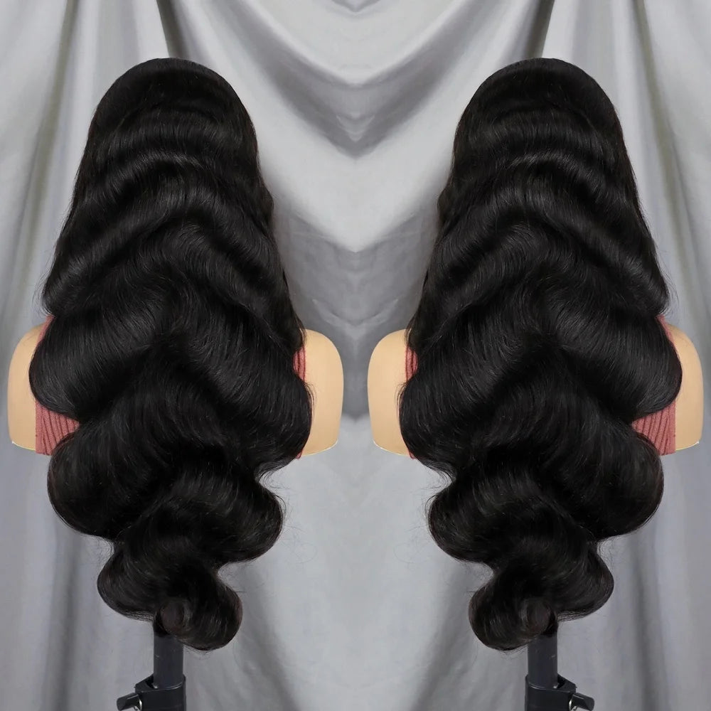 Two views of a long, wavy black wig displayed on mannequin heads against a draped light gray fabric background.