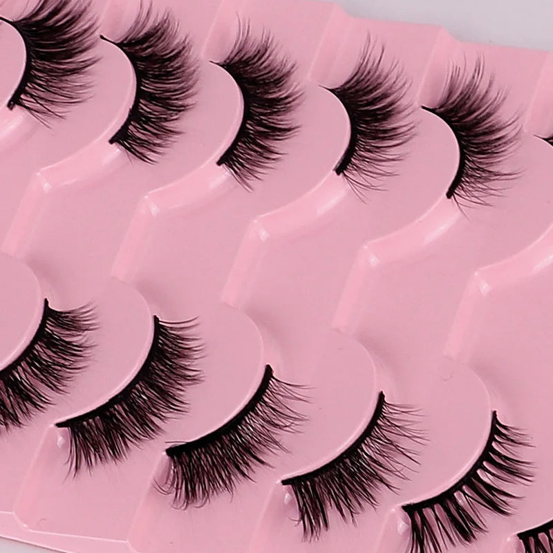Set of false eyelashes on a pink tray