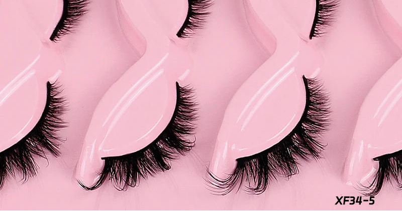 False eyelashes with a pink background and text 'Longer eyes and longer tails, stronger makeup'.