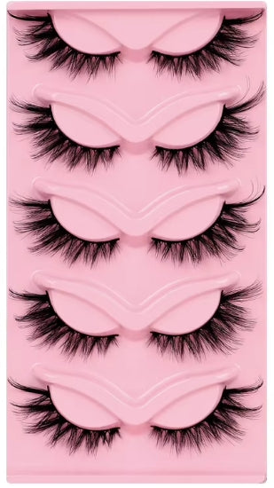 Five pairs of black false eyelashes arranged in a pink plastic tray with matching pink molded lash pads.